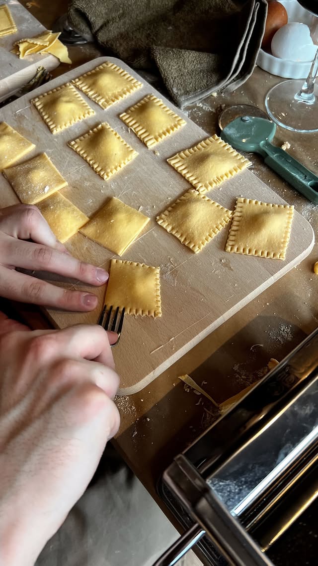 Hands making pasta